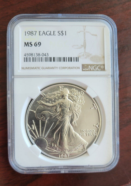 1987 $1 Silver Eagle NGC MS69 Dollar Brown Label Holder .999 Fine Silver 1oz.